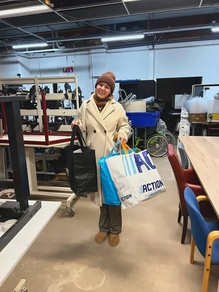 Person in coat with bags in the workspace of an elective tropical medicine internship